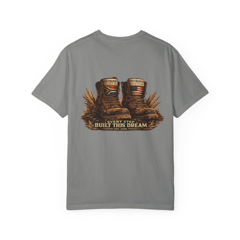 Grey T-shirt with boots graphic and 'Every Step Built This Dream' text