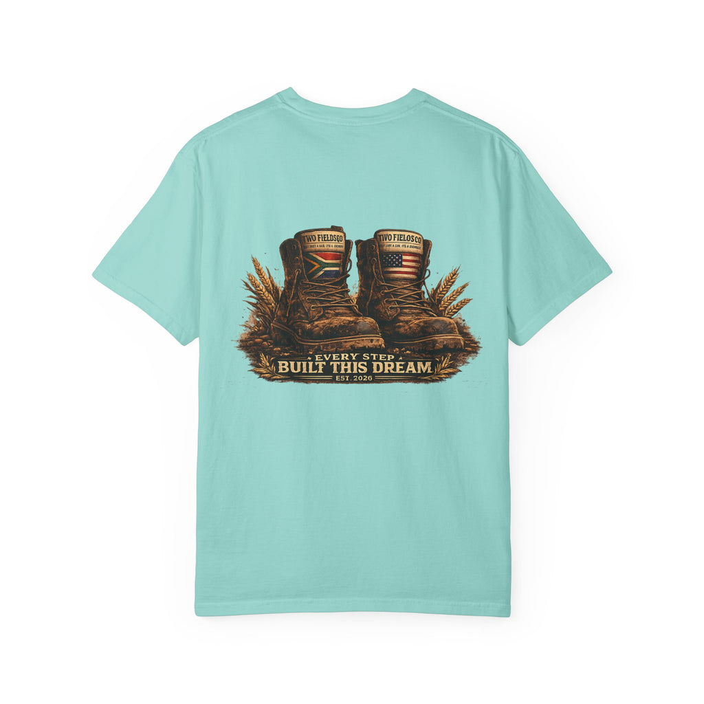 Mint green T-shirt with boots graphic and 'Every Step Built This Dream' text