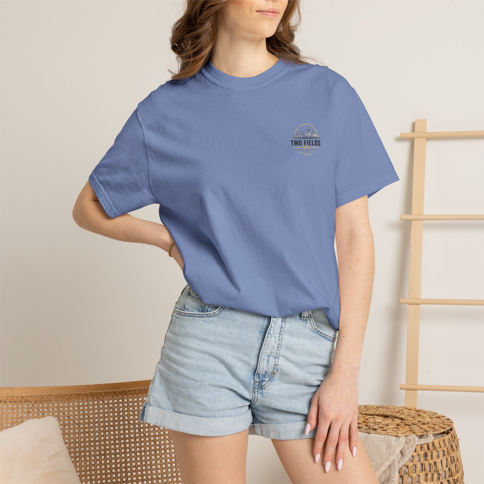 Blue graphic T-shirt on model, chest shows small Two Fields logo