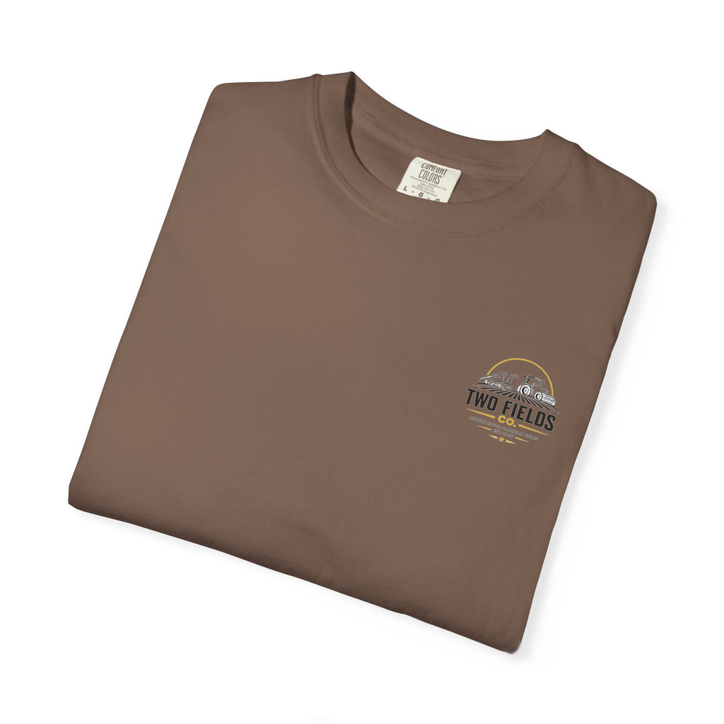 Brown folded graphic t-shirt with small chest logo patch