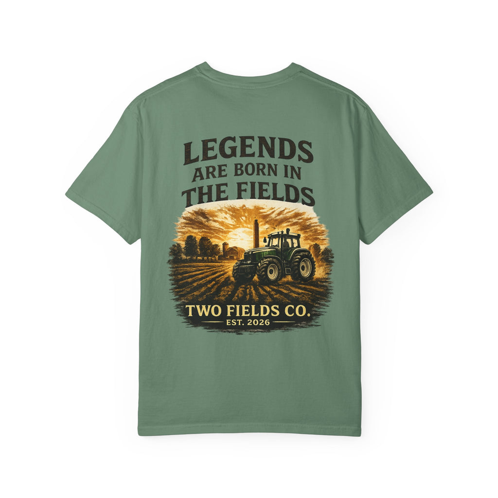 Green T-shirt with front graphic featuring tractor scene and text “TWO FIELDS CO.”