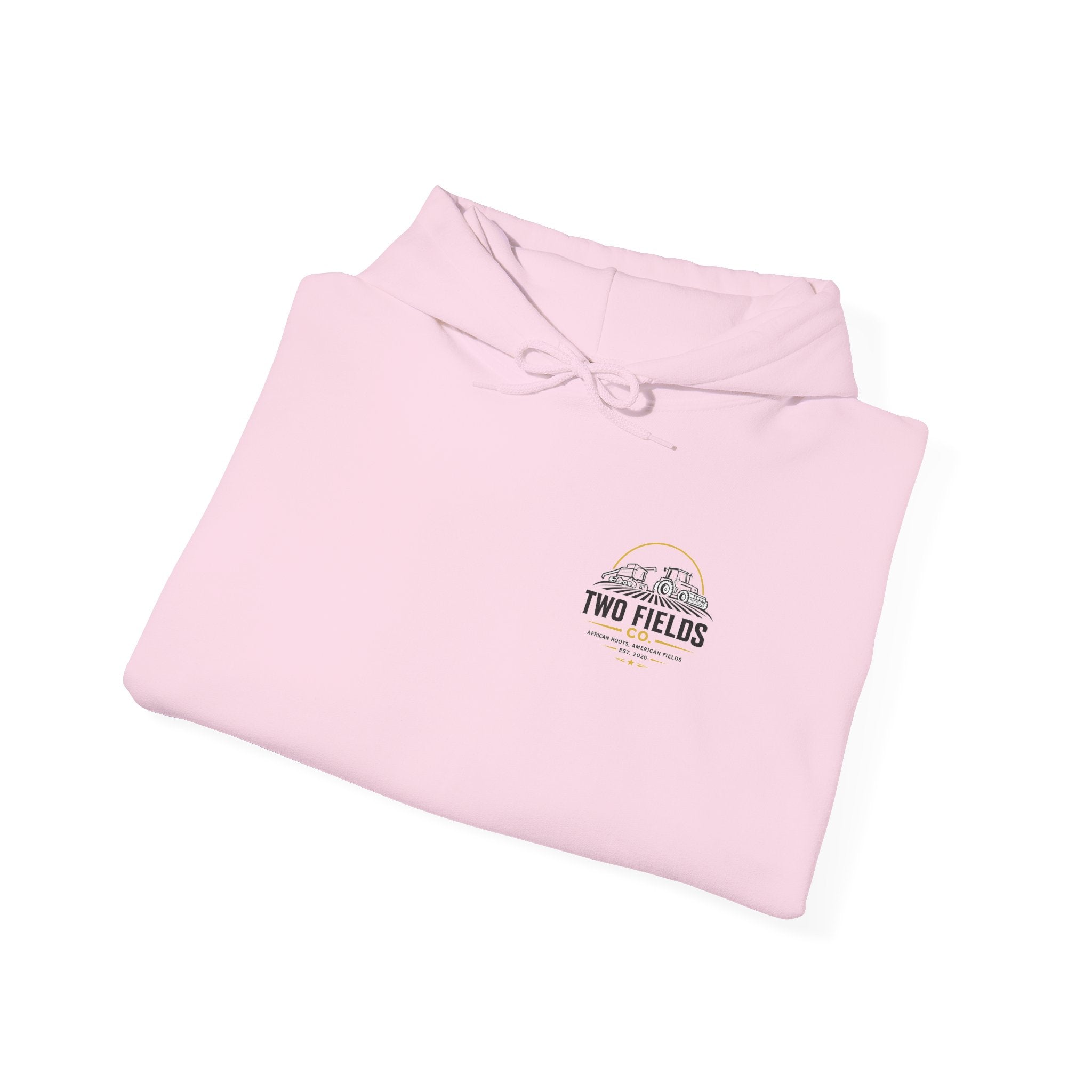 Folded light pink hoodie with small Two Fields Co. logo graphic and hood ties