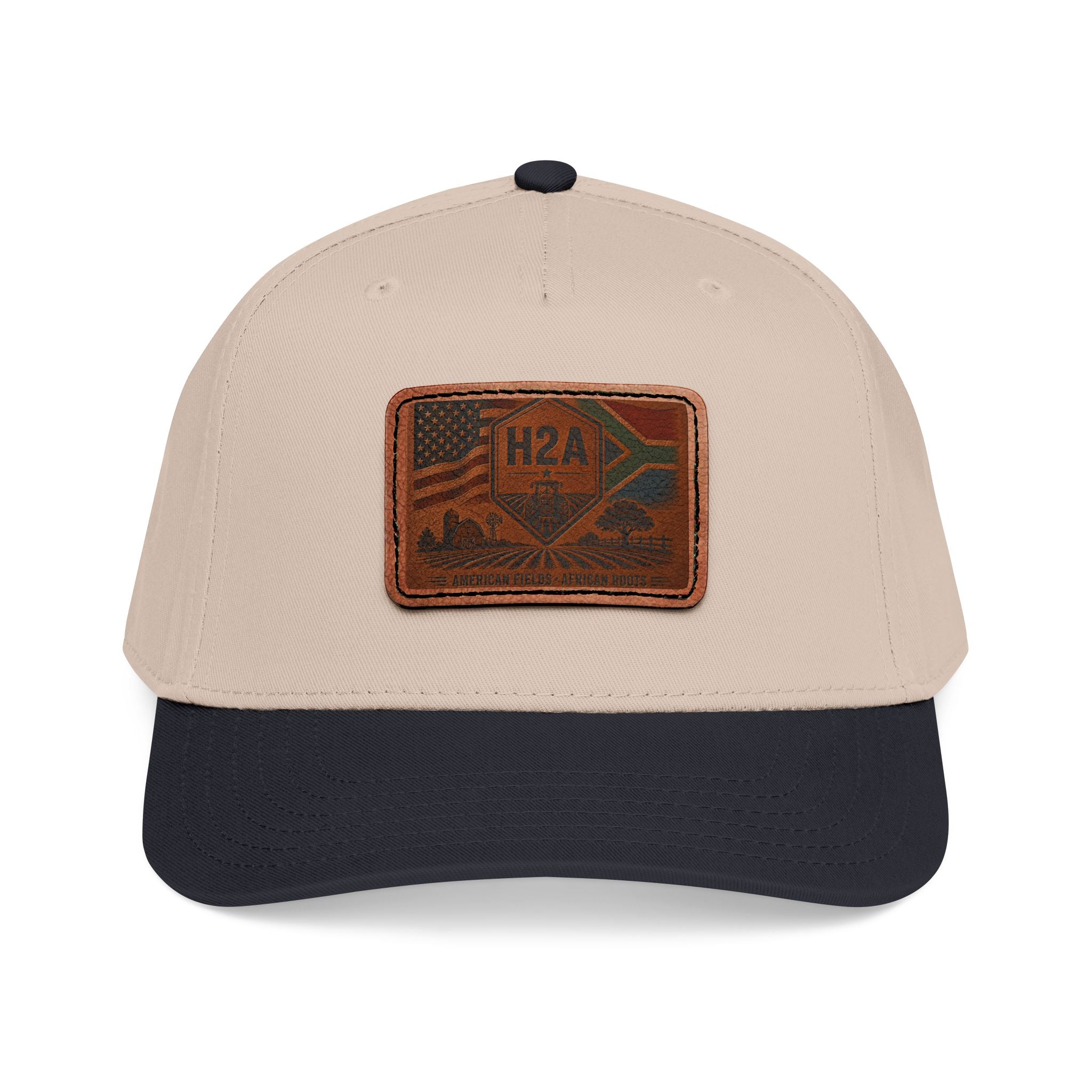 Beige baseball cap with dark blue brim and rectangular H2A flag leather patch.