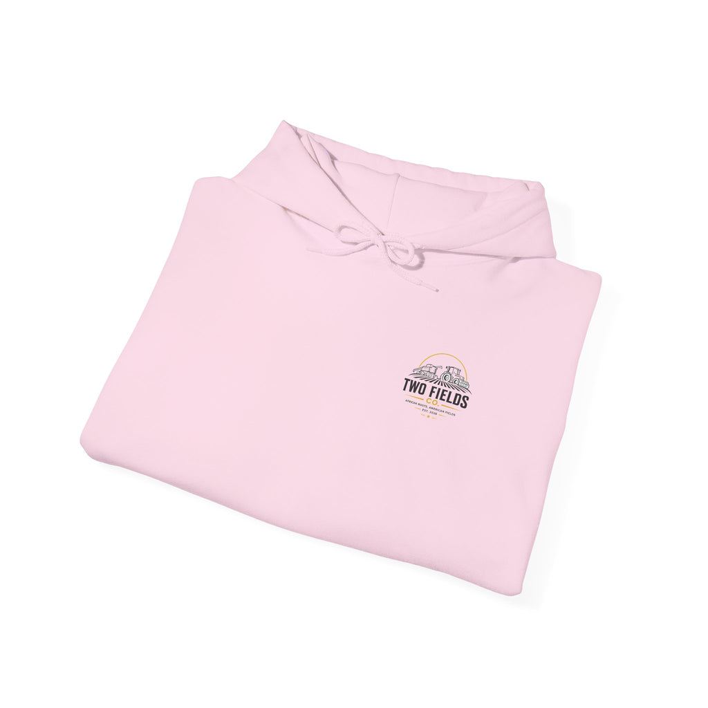 Pink vintage tractor hoodie folded flat, small chest logo with tractor and US flag
