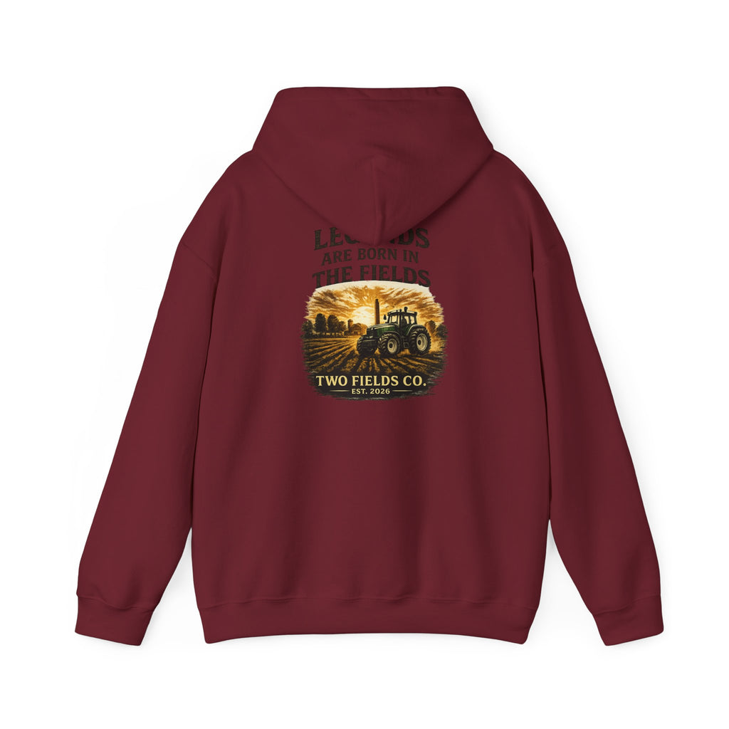 Red hooded pullover sweatshirt with tractor graphic and slogan on back